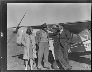 Miss Curtiss (right), Ross Curtiss and D Greig from Ranfurly, in front of an Auster airplane, Timaru airport