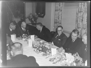 BCPA (British Commonwealth Pacific Airlines) opening dinner event, showing (L to R) Mr Hackett, ?, Mr Jones, Mr Drakefor, Mr Shanahan and an unidentified man, seated at a table, location unidentified