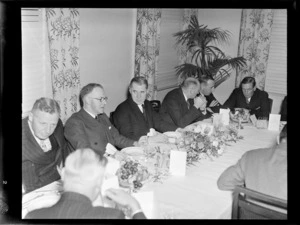 BCPA (British Commonwealth Pacific Airlines) opening dinner event, showing (L to R) Mr Shanahan, Mr Drakefor, Mr Jones, ?, Mr Haekett and Sir Leonard Isitt seated at a table, location unidentified