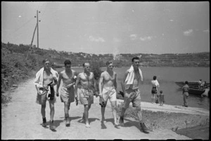 New Zealanders at Divisional HQ picnic walking alongside Lake Albano, Italy, World War II - Photograph taken by George Kaye
