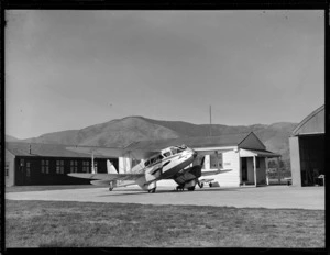 NZNAC (New Zealand National Airways Corporation) Rapide 'Tawaka' airplane, outside a waiting room, Blenheim