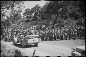 Car carrying King George VI passes through lines of New Zealanders during visit to the NZ Division in Italy, World War II - Photograph taken by George Kaye