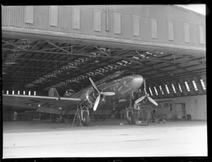 Aircraft 'Dakota' being converted for civilian use, inside aircraft hangar, at Harewood Aerodrome (Christchurch International Airport)