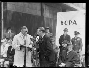 Ivan Holyman, Chairman of Australian National Airways, left, and Mr F Hackett, on stage at opening ceremony of British Commonwealth Pacific Airlines' trans Pacific service, Whenuapai Airport, Auckland