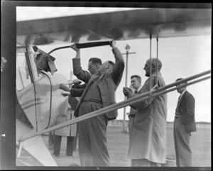 Unidentified men refueling an Auster aircraft, at Invercargill Airport