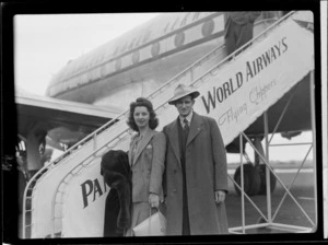 Mr and Mrs John Thorp, standing next to PAWA (Pan America World Airways) Clipper airliner