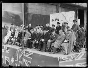 Group of dignitaries on stage, at opening ceremony for British Commonwealth Pacific Airlines' trans Pacific service, Whenuapai Airport, Auckland