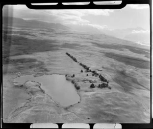 Guide Hill Station, Tekapo, Mackenzie district, Canterbury Region, showing a farmhouse beside a lake