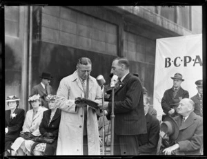 Opening ceremony, British Commonwealth Pacific Airlines, showing Mr F Hackett [PMG?], right, presenting Ivan Holyman with mail for transportation on inaugural trans Pacific flight to Vancouver