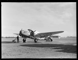 View of NZ NAC Lockheed 18-56 Lodestar aeroplane 'Kawatere' ZK-ANA with unidentified ground crew at Harewood Airport, Christchurch City, Canterbury Region