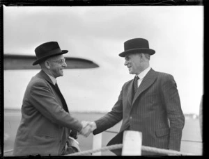 The Honourable F Jones, right, with the Honourable AS Drakeford, [Whenuapai Airport, Auckland?]