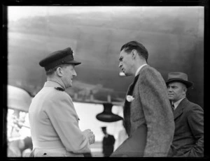 Captain P Taylor, pilot of the British Commonwealth Pacific Airlines inaugural trans Pacific flight to Vancouver, left, with Quin Campbell, of Pan American World Airways, Whenuapai Airport, Auckland