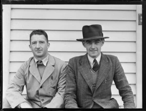 Two unidentified [NZNAC staff?] men, outside a building, Omaka, Blenheim