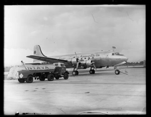 Douglas DC-4 Skymaster aeroplane 'Tatana' VH-AND, being refueled at Whenuapai Airport, Auckland