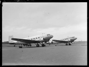 View of two RNZAF Dakota transport planes (in front NZ3542) parked at Harewood Airport, Christchurch City, Canterbury Region