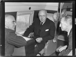 Group portrait of (L to R) Mr Dickson, New Zealand Prime Minister Peter Fraser and Mr Salmon, sitting on a flight to Wellington on visiting British Vickers Viking passenger plane G-AJJN