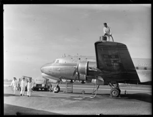 TAA (Trans Australian Airways) Skymaster DC4 passenger plane 'Thomas Mitchell' being refuelled with Shell Aviation Fuel by unidentified ground crew at Whenuapai Airport, Auckland City