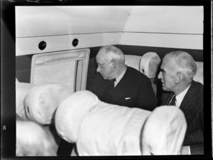 Portrait of (L to R) the New Zealand Prime Minister Peter Fraser and Mr Dickson, on a flight to Wellington on visiting British Vickers Viking passenger plane G-AJJ