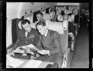 View of unidentified passengers on visiting British Vickers Viking passenger plane G-AJJN