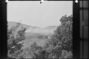 Enemy territory covered by smoke from New Zealand guns and mortars during advance to Florence, Italy, in World War II - Photograph taken by George Kaye