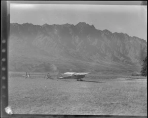 Auster tours, showing an Auster ZK-AOB airplane, Queenstown, including hills in the background