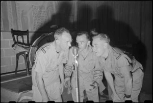 Dishwasher, cook and laundryman provide entertainment at farewell to Colonel D Pottinger at Molfetta, Italy, World War II - Photograph taken by George Bull