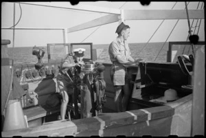 Sub Lieutenant G E W Prestridge and Signalman R Geraghty on the bridge of World War II minesweeper in the Adriatic - Photograph taken by George Bull
