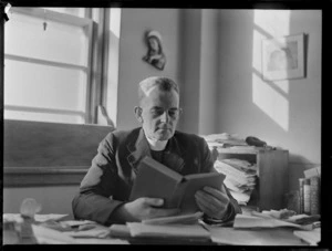 Portrait of Father McKeefery at his desk, for Zealandia Catholic Newspaper, [Auckland?]