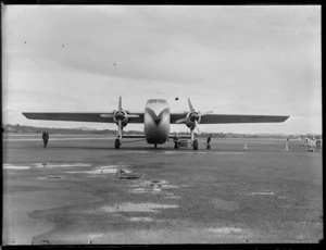 Front view of visiting Bristol Freighter transport plane 'Merchant Venturer' G-AIMC with ground crew, Whenuapai Airfield, Auckland