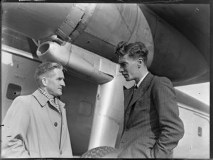 Portrait of (L to R) Mr M F Elliott (Bristol Sales Representative) and Mr W Burns (Engineer), crew members with Bristol Freighter transport plane 'Merchant Venturer' G-AIMC, Whenuapai Airfield, Auckland