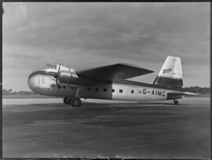 Side view of visiting Bristol Freighter transport plane 'Merchant Venturer' G-AIMC on runway, Whenuapai Airfield, Auckland