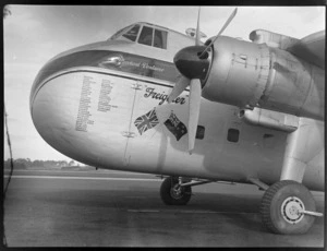 Close-up nose view of visiting Bristol Freighter transport plane 'Merchant Venturer' G-AIMC with names of airports visited on front cargo door, Whenuapai Airfield, Auckland