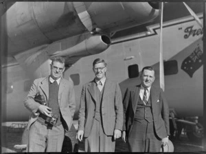 Mr G H Stephenson (PWD), Mr D S Robertson and Mr G G Sinton, in front of a Bristol Freighter aircraft, Kaikohe