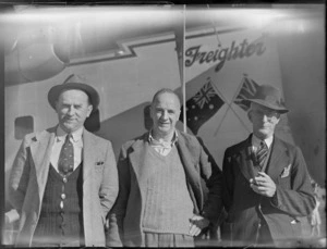 Kaikohe businessmen, Mr W M Wilkinson (from left), Mr P J Coyne and Mr W C Bell, in front of a Bristol Freighter aircraft, probably Kaikohe