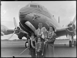 Mr and Mrs C Pollard and three children, during an arrival of a PAA (Pan American Airways) Clipper Celestial aircraft, location unidentified