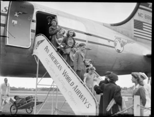 Stoddard children, leaving a PAWA (Pan American World Airways) Clipper Kathay NC88883 aircraft, location unidentified
