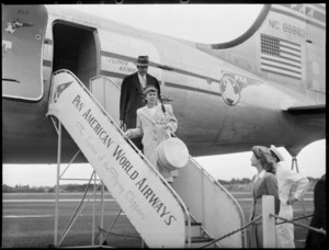 Lady Smith and Mr Enright [Dec?], arriving on a PAA (Pan American Airways) Clipper Kathay NC88883 aircraft, location unidentified
