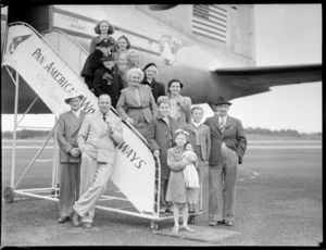 Three generations of Stoddards, Hodges and another unidentified family, showing family members, including children standing on a gangway of a PAA (Pan American Airways) Clipper Kathay NC88883 aircraft, location unidentified