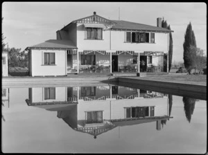 Bristol Freighter tour, Hawkes Bay and East Coast Aero Club, Hastings, showing exterior view of the Clubhouse reflected in the swimming baths