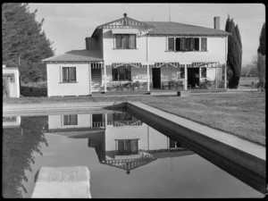 Bristol Freighter tour, Hawkes Bay and East Coast Aero Club, Hastings, showing exterior view of the Clubhouse reflected in the swimming baths