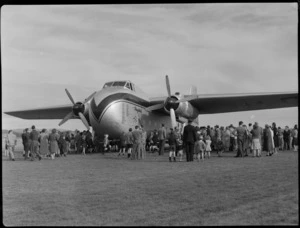 Unidentified people viewing aircraft Bristrol Freighter, at Waharoa, Matamata, Waikato region