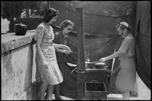 Italian female refugees cooking on stove in southern Florence, Italy, World War II - Photograph taken by George Kaye