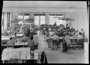 Factory interior, Parisian Neckwear Company Ltd, Auckland, showing female workers sitting at worktables
