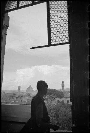 Dome of Cathedral and tower of Palazzo Vecchio seen through shattered window of Pitti Palace in Florence, Italy, World War II - Photograph taken by George Kaye