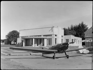 A monoplane on ground outside the clubrooms at Auckland Aero Club, Mangere, Manukau City, Auckland Region