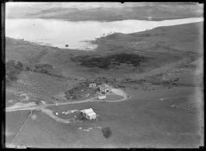 Lake Whangape, Waikato Region, featuring the residence of Doctor Pinfold; a farmhouse and outbuildings