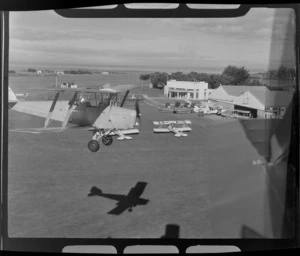 De Havilland DH 83 Tiger Moth biplane, in flight over Auckland Aero Club, Mangere, Manukau City, Auckland Region