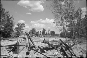 Dried up bed of Pisa River with demolished bridge in foreground, Italy, World War II - Photograph taken by George Kaye
