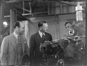 Willard Whitney Straight, left, and Lord Knollys, both of British Overseas Airways Corporation, inspecting aircraft engines in an aviation workshop, during their visit to New Zealand