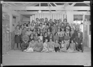 Group portrait of Parisian Neckwear Company Ltd staff, in their workroom, Auckland